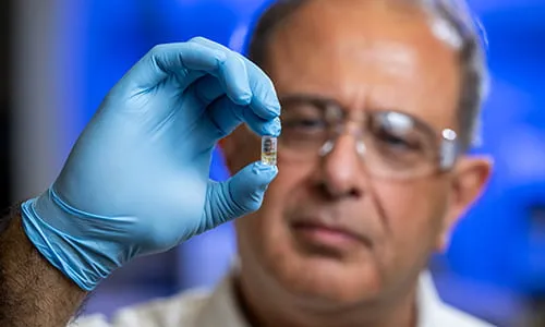 man holding a pill