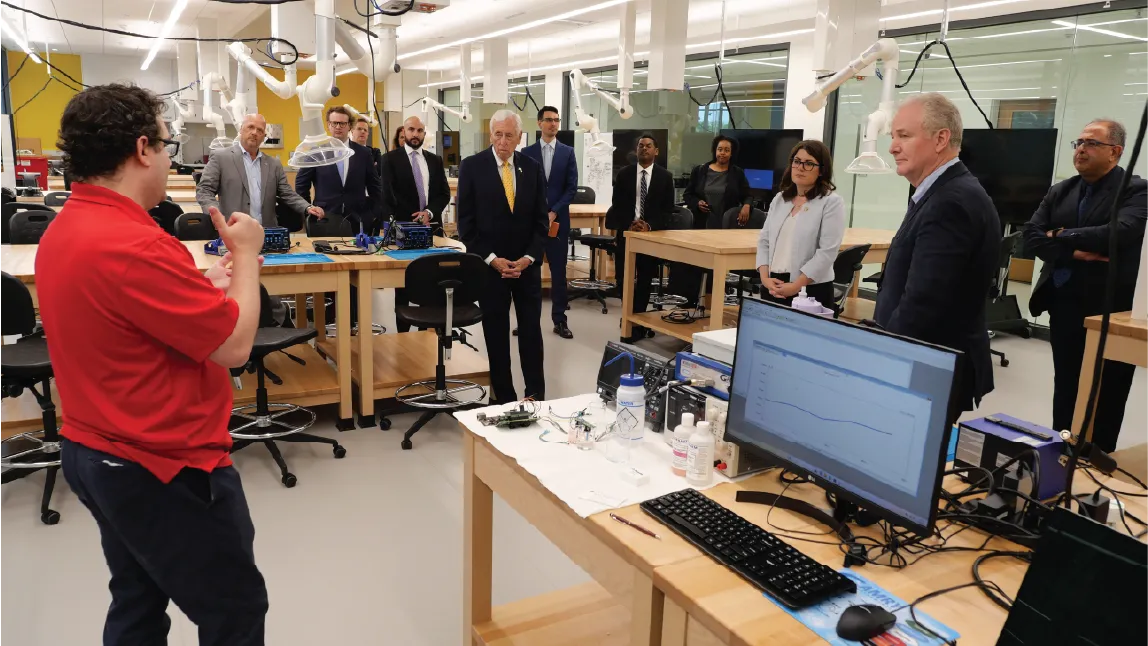 MATRIX Lab Director of Remote Sensing and Microsystems Justin Stine (left) explains the work on ingestible capsules going on in the building’s new Advanced Manufacturing Lab.